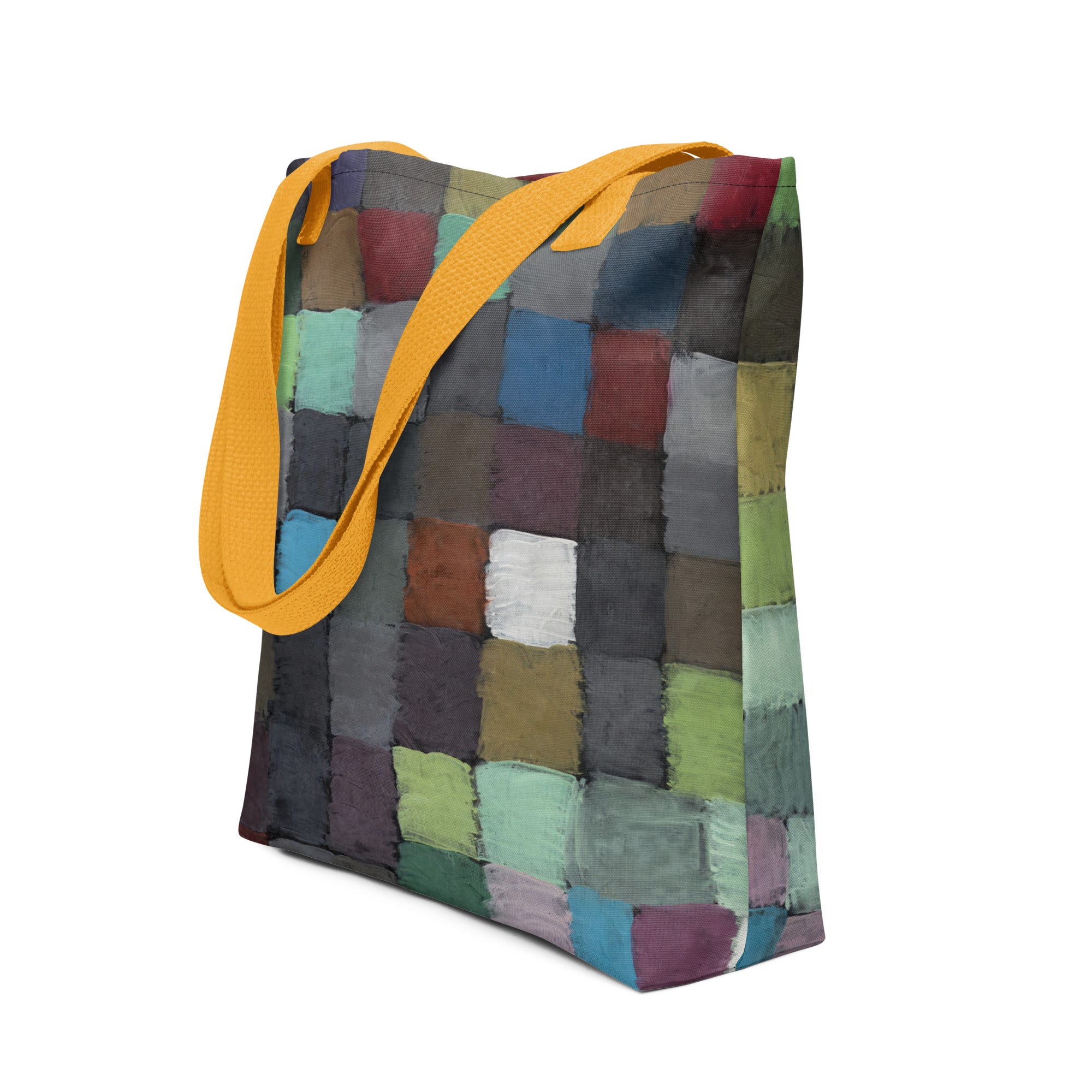 Coocosh vibrant patchwork tote bag, featuring a striking yellow strap, blends colorful textures for an eye-catching accessory. Ideal for stylish beach outings or everyday errands, its durable design ensures both functionality and flair.