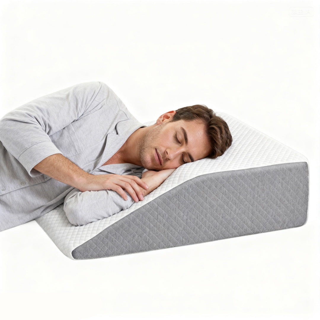 Coocosh wedge pillow in white and gray with a man sleeping comfortably on it, offering a supportive and elevated sleep experience for ultimate relaxation.