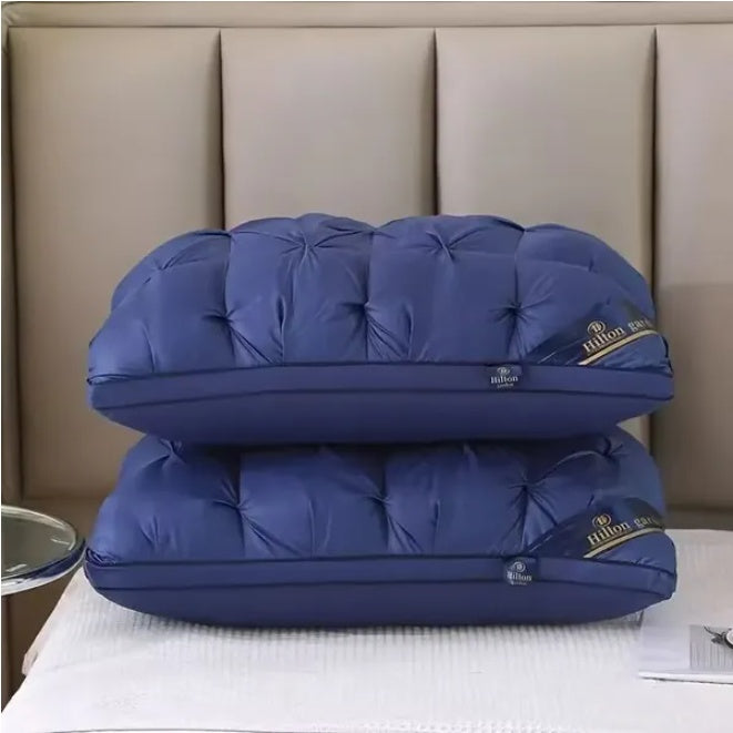 Hilton luxury tufted down alternative pillows in deep blue, offering plush comfort for an enhanced sleep experience, presented stacked from a front-facing perspective.