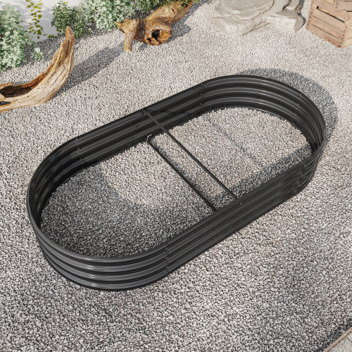Coocosh raised garden bed in an oval shape made from durable metal in black, shown from a ground-level perspective on a gravel base, perfect for creating a contained gardening space outdoors.