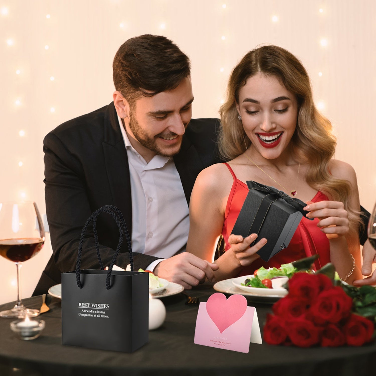 Coocosh Gift Bag featuring a stylish black box with ribbon, perfect for special occasions, complemented by a romantic dining setting with a heart-shaped card, adding a personal touch.