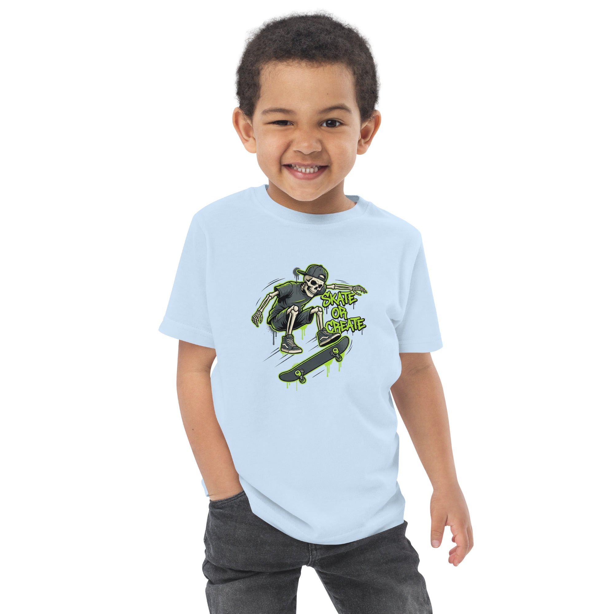 Child wearing a light blue t-shirt with a graphic design on a white background