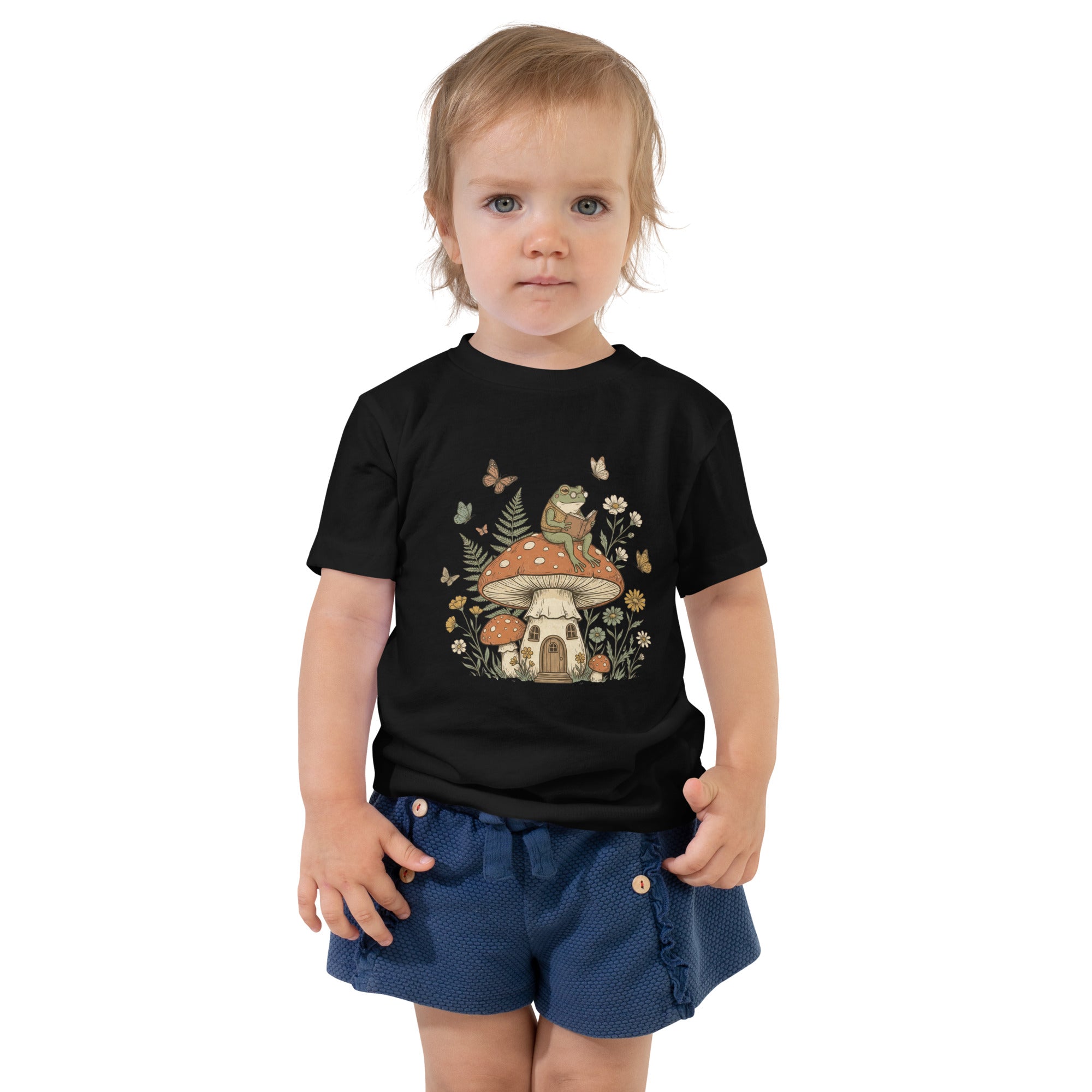 Coocosh toddler tee featuring a delightful frog and mushroom design in pastel colors, crafted from soft cotton for all-day comfort.