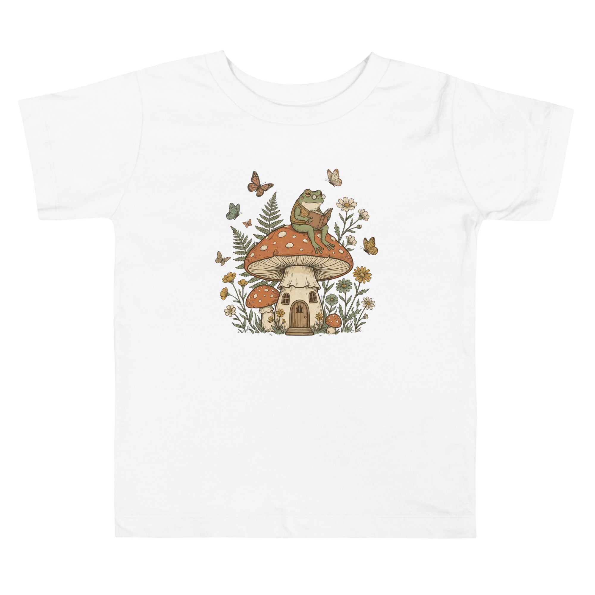 Coocosh black toddler t-shirt with whimsical frog and mushroom illustrations, crafted from breathable fabric for comfort during playtime.