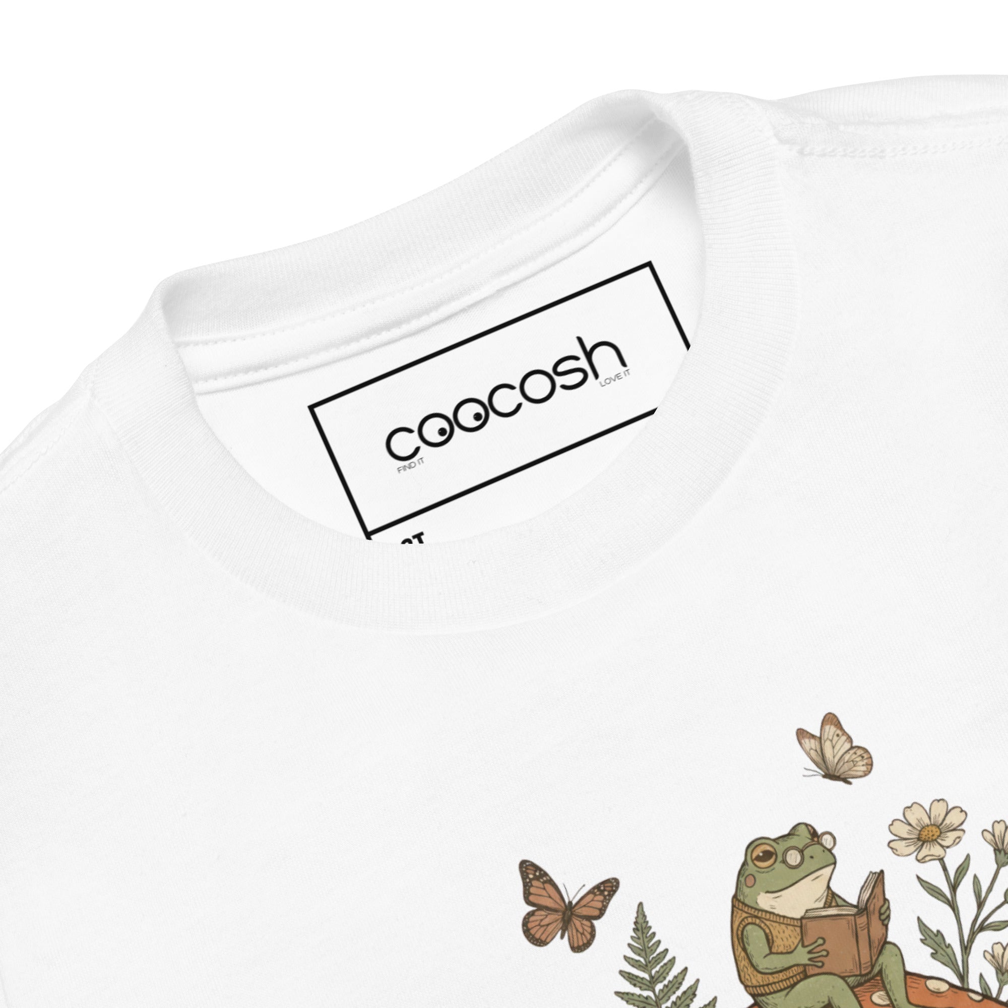 Coocosh playful t-shirt for toddlers, showcasing a cheerful frog and mushroom motif in vibrant orange, perfect for sunny day activities.