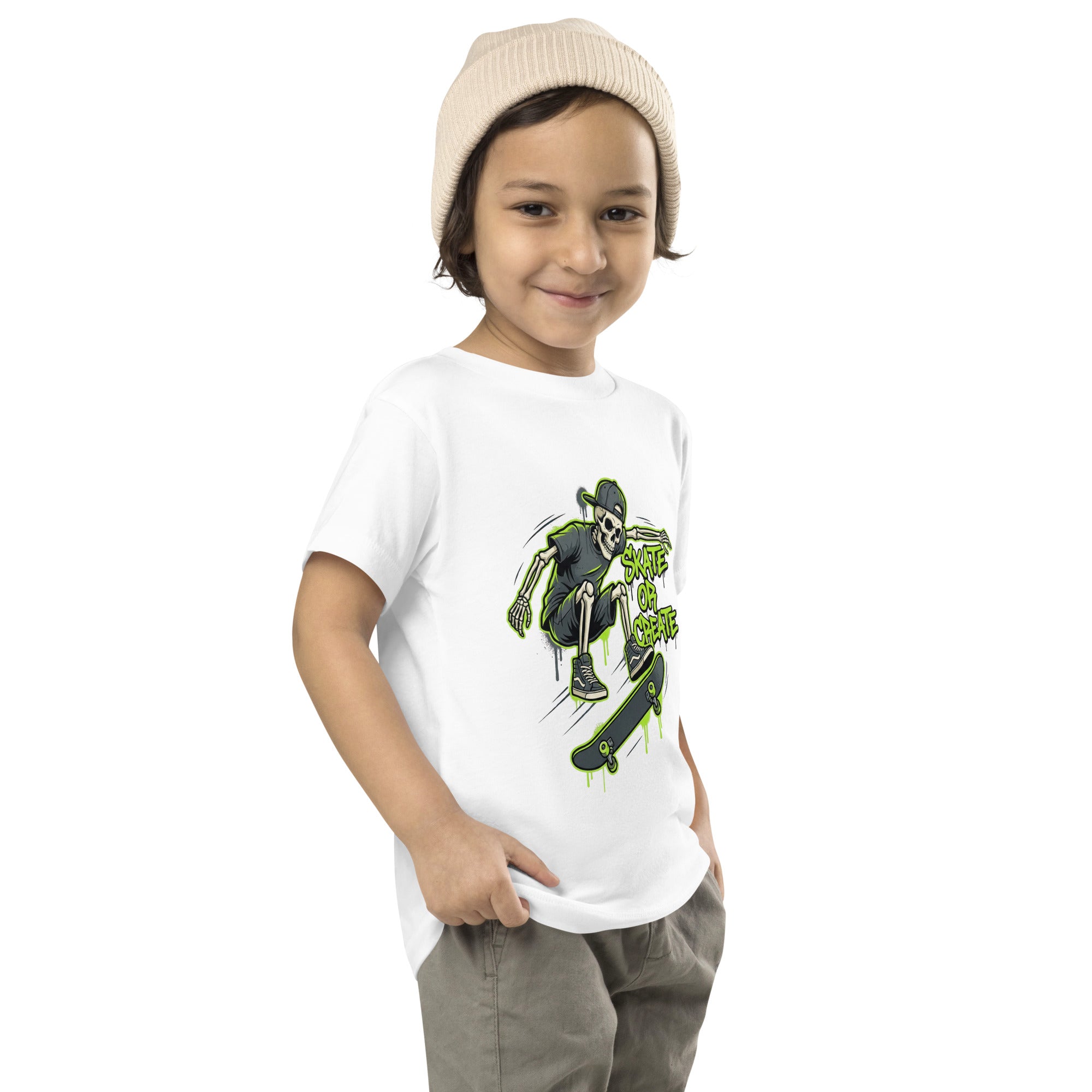 This Coocosh shirt features a lively skeleton skater on a lime green background, perfect for imaginative toddlers.