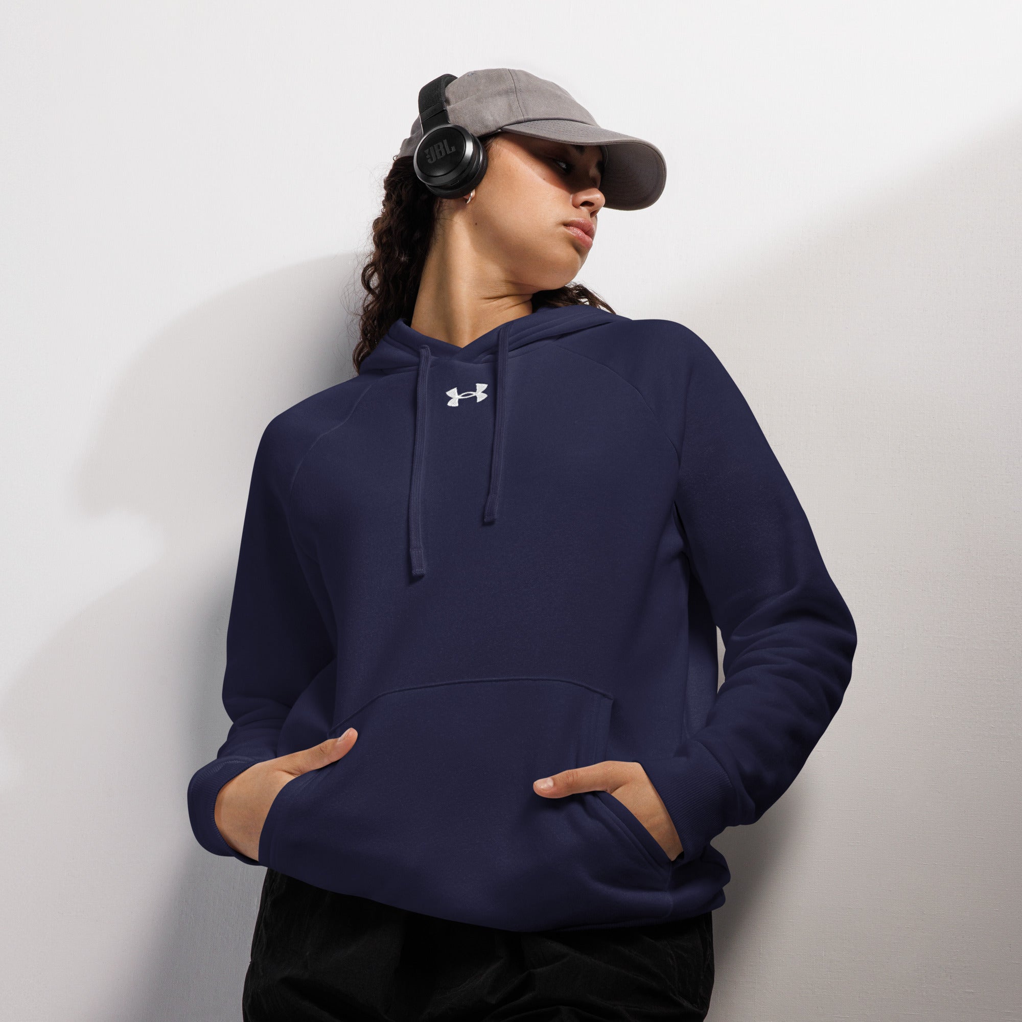 Coocosh Under Armour® Joy-Pills Hoodie, a cozy blend of 80/20 cotton-poly fleece, designed for comfort and style. Perfect for lounging or active pursuits, this unisex piece features ribbed cuffs and a convenient front pouch pocket, ensuring warmth from any angle.